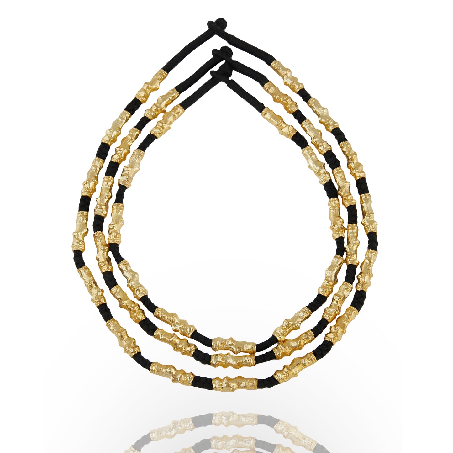 stacked gold plated and black thread necklace