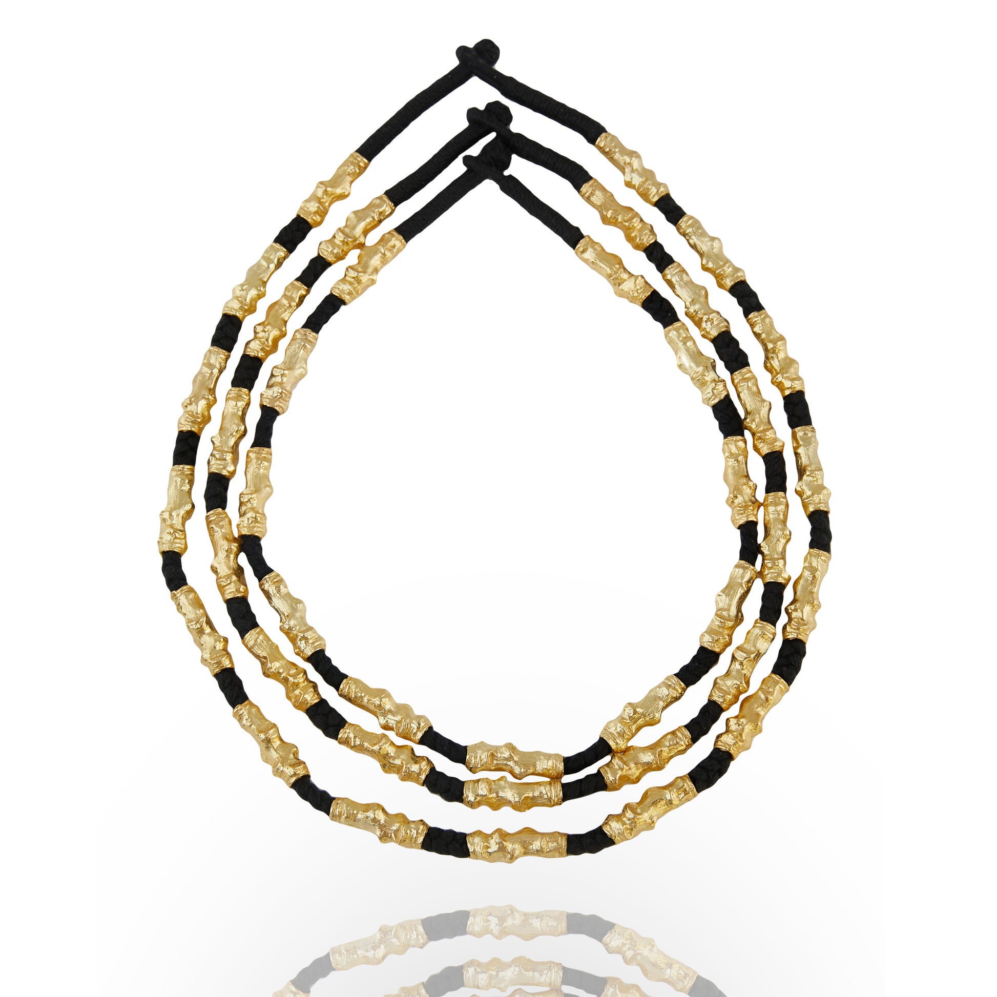 stacked gold plated and black thread necklace