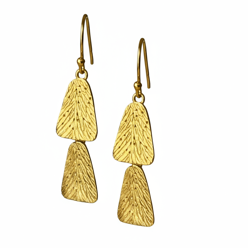 Pair of gold earrings on a white background